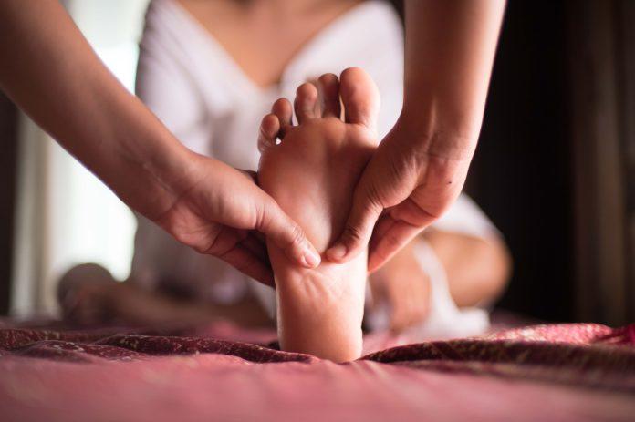 massage on woman body in the spa