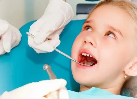 Child receiving gentle restorative dental treatment in Parker, CO