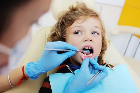 Child receiving a pediatric dental crown in Houston at Lakewood Kids Dentistry.