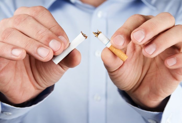 Quit,Smoking,,Human,Hands,Breaking,The,Cigarette