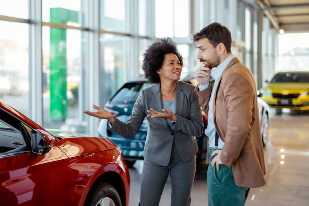 Afro Wife Asking Husband to Buy New Car at the Dealership